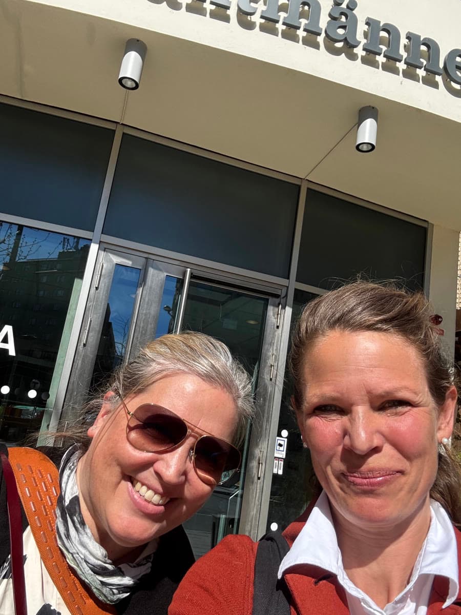 Two Unibloom team members outside an office