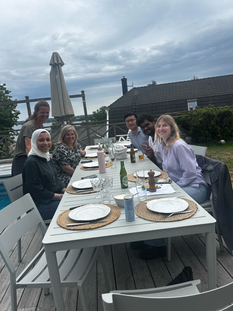 The Unibloom team at dinner together on a terrace